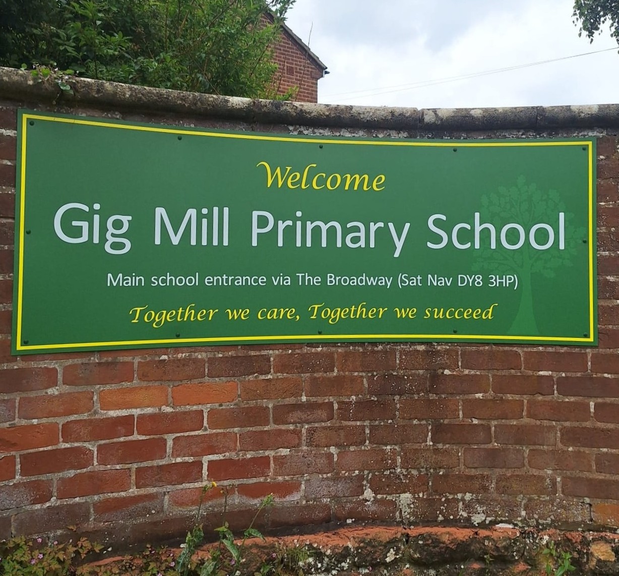 Flat wall sign installed on a school building